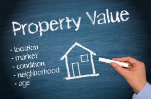 Property Value - Real Estate concept on blue background