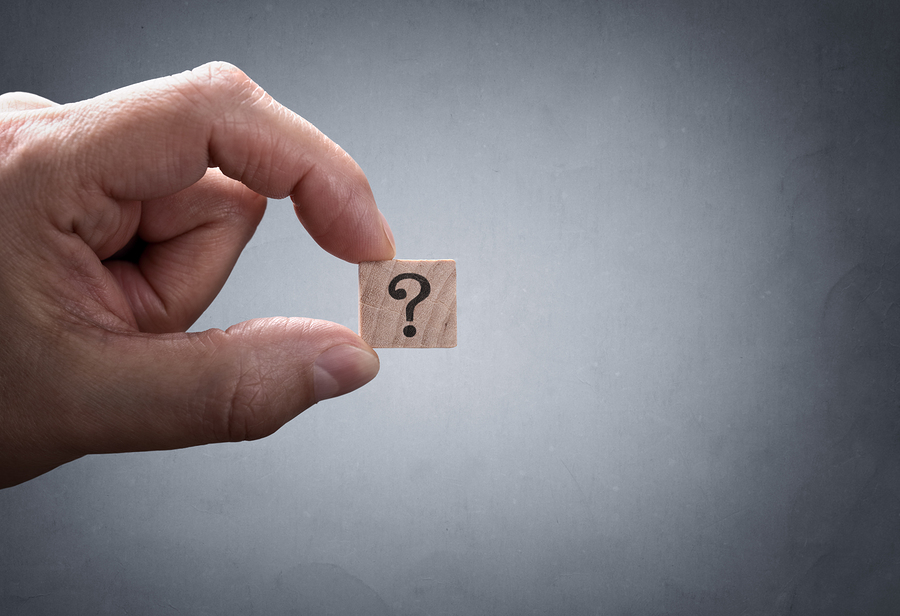 Businessman holding a question mark concept for confusion, quest finance 4 u answering your finance questions